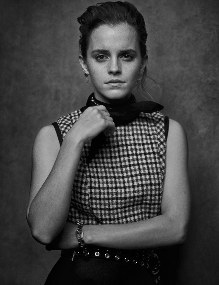 Actress Emma Watson poses in Louis Vuitton dress, Hermes belt and Isabel Marant earrings