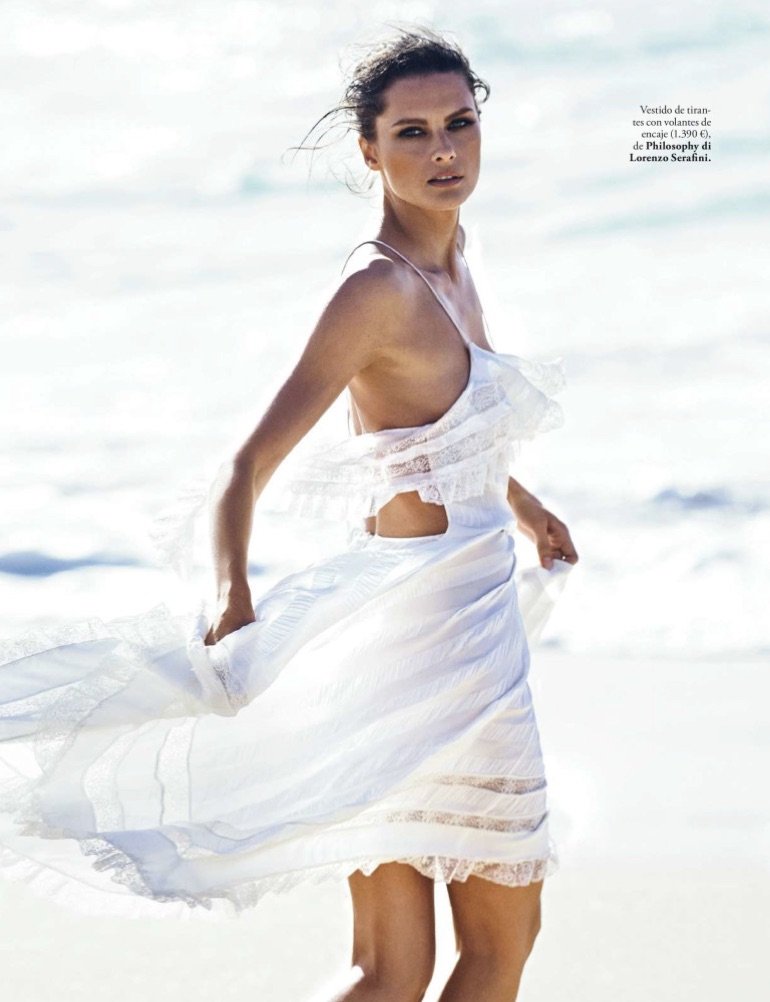 Getting windswept, Elena Melnik models Philosophy di Lorenzo Serafini dress with ruffles and lace